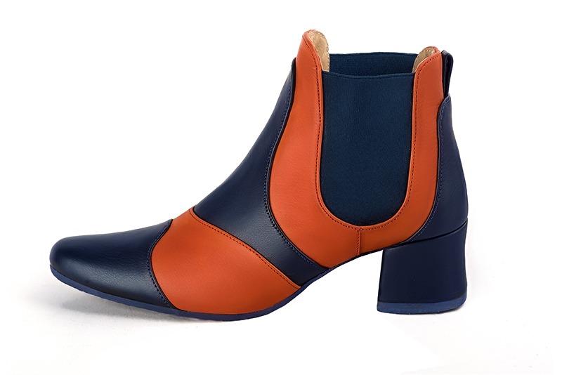 Navy blue and clementine orange women's ankle boots, with elastics. Round toe. Low flare heels. Profile view - Florence KOOIJMAN